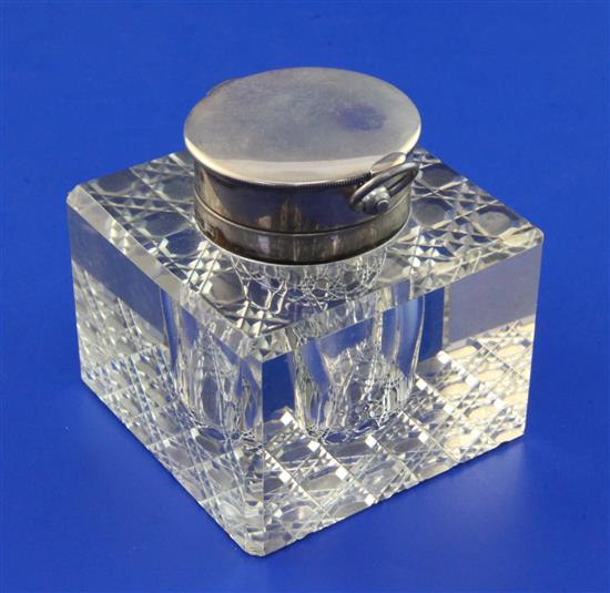 An Edwardian silver mounted glass combination inkwell/ pocket watch holder, height 3in.